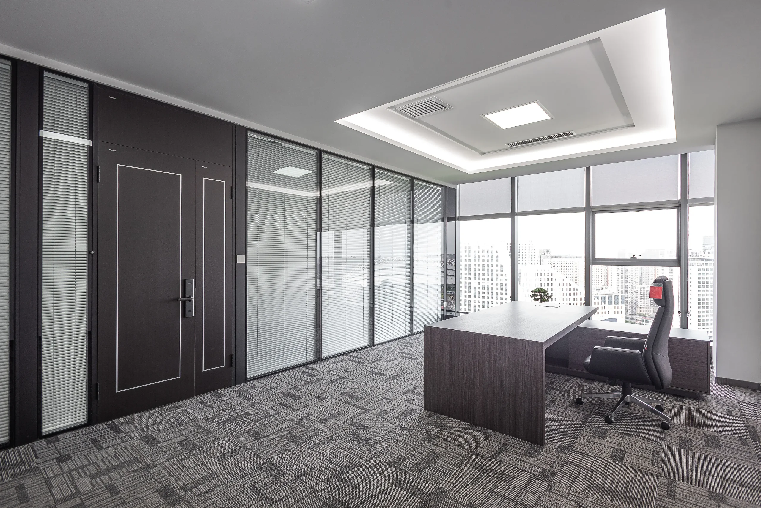 Boardroom design guidelines acoustic isolation showing double glazed partition with Rw 50 dB rating for executive confidentiality