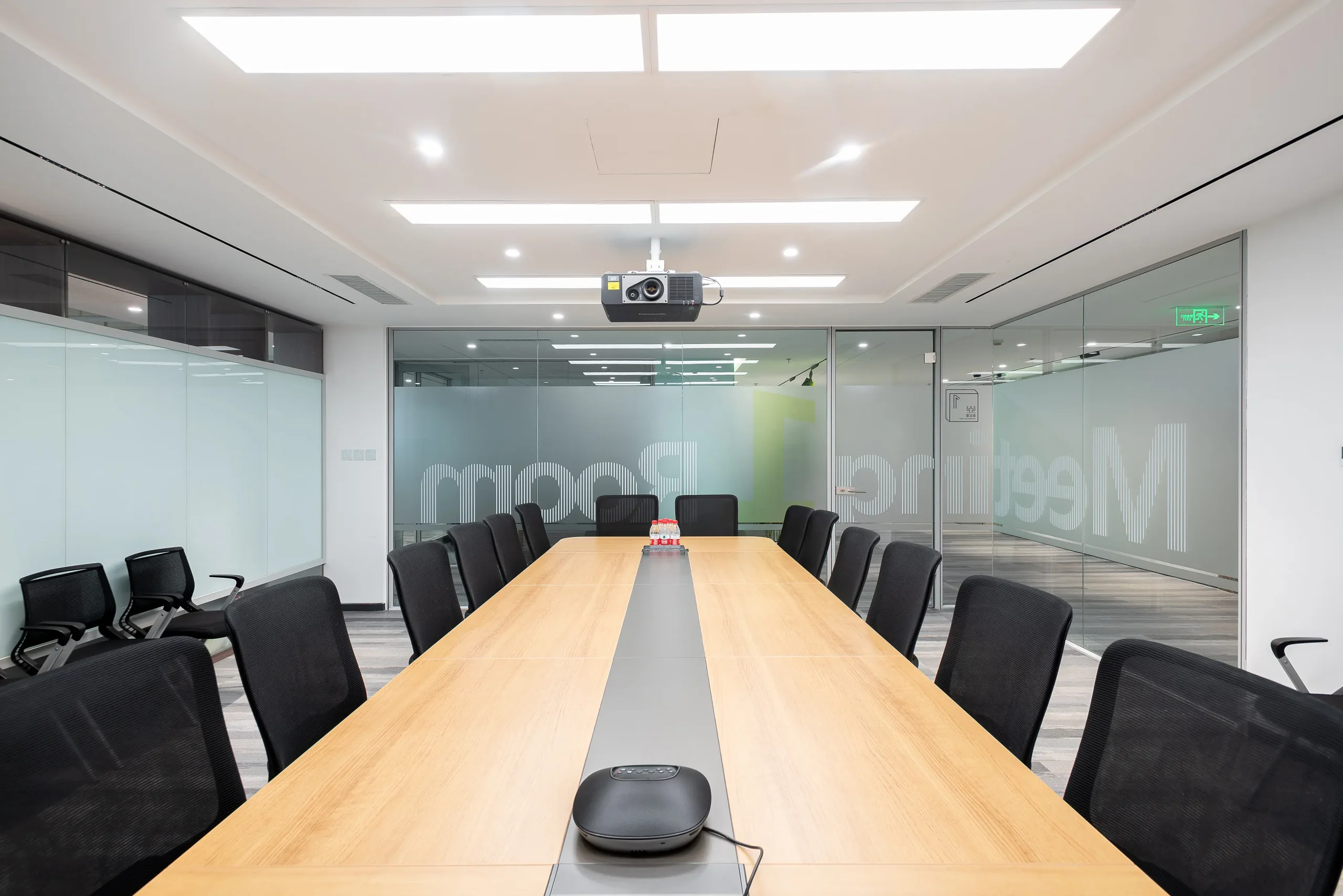 WELL building acoustics NIC 53 target: large boardroom enclosed with aluminum framed glass partition walls