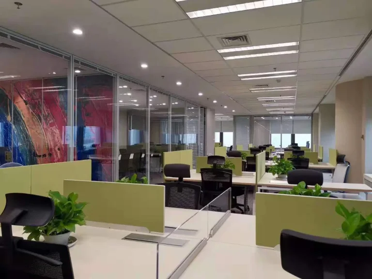 Aluminum framed glass partition system separating open office workstations and meeting room (Cushman & Wakefield project)
