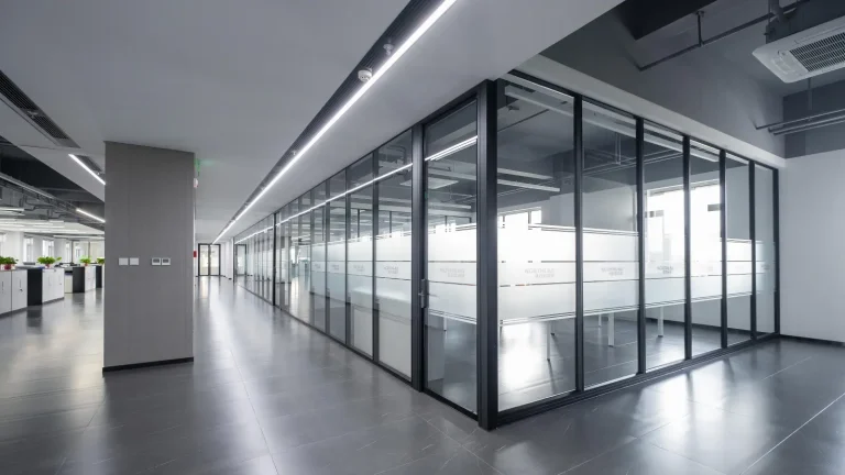 Double glazed glass partition with internal blinds for office corridor privacy (NorthLab Laboratory project)