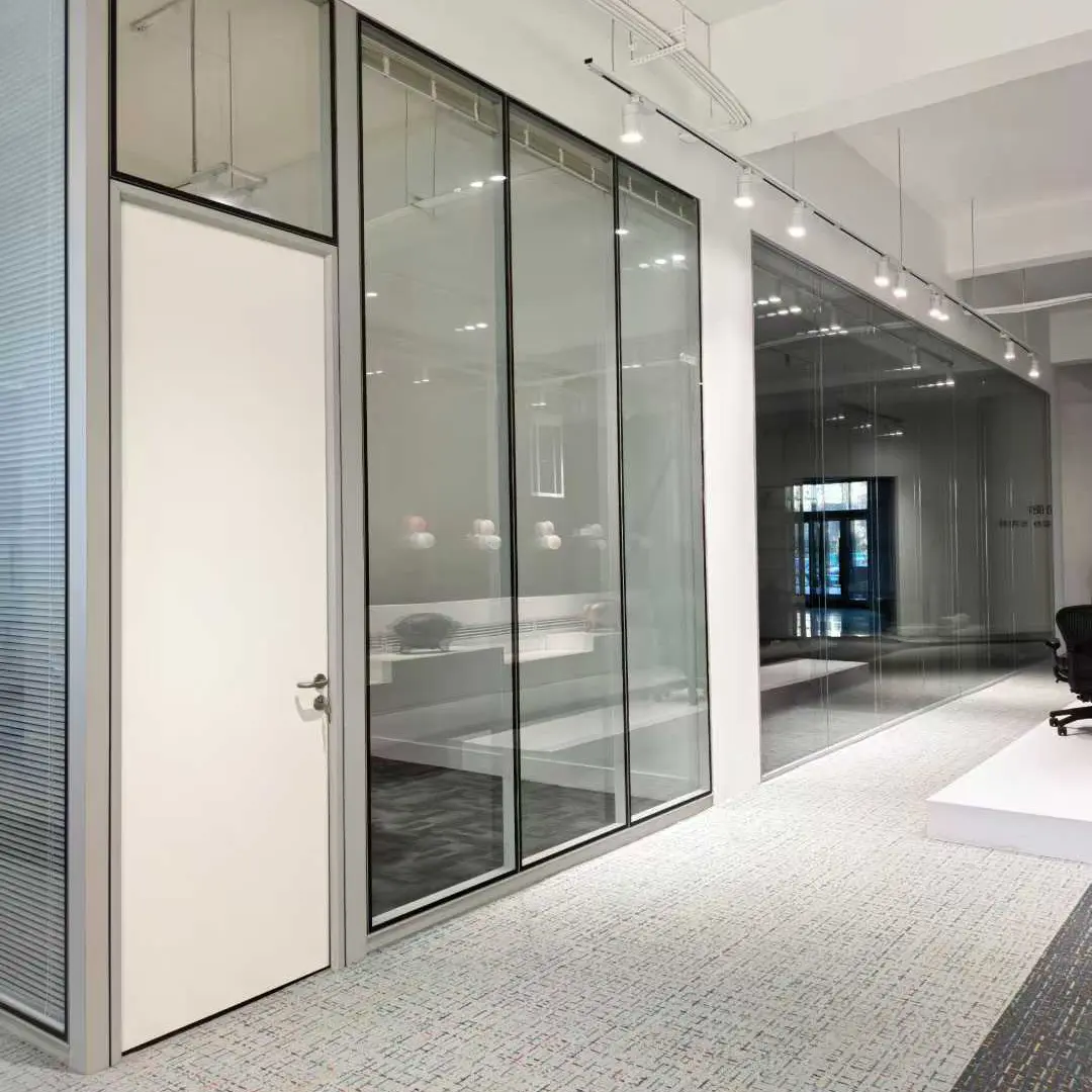 Steel personnel door installed alongside an aluminium framed glass partition in a modern office